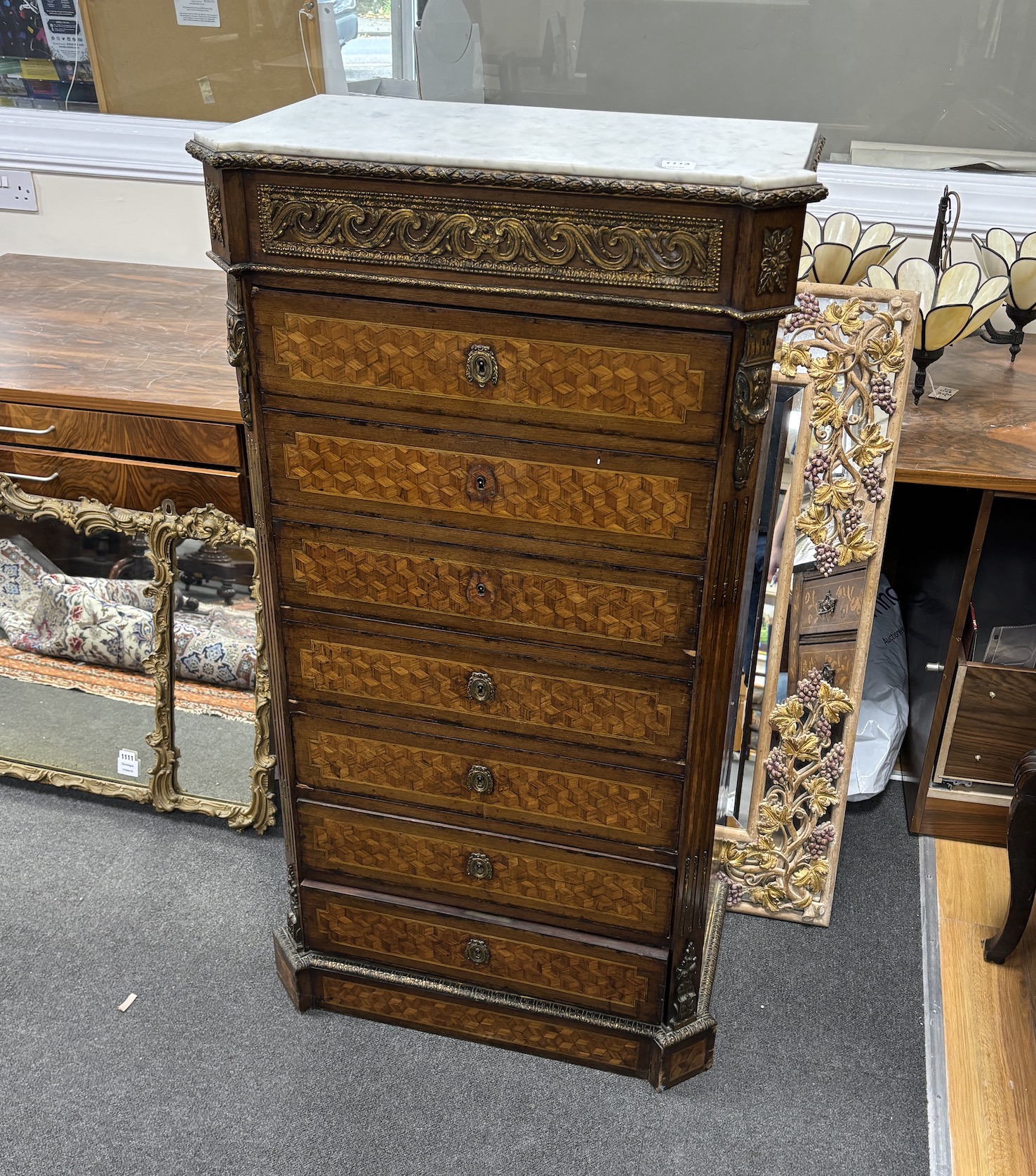 A 19th century French Transitional style parquetry inlaid semanier, gilt metal mounted with white marble top, width 70cm, depth 38cm, height 128cm